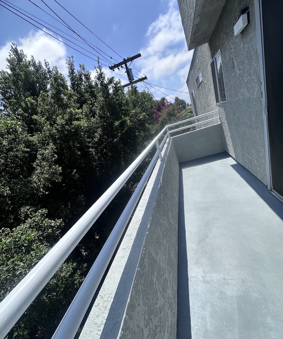 Finished waterproof deck coating and railing