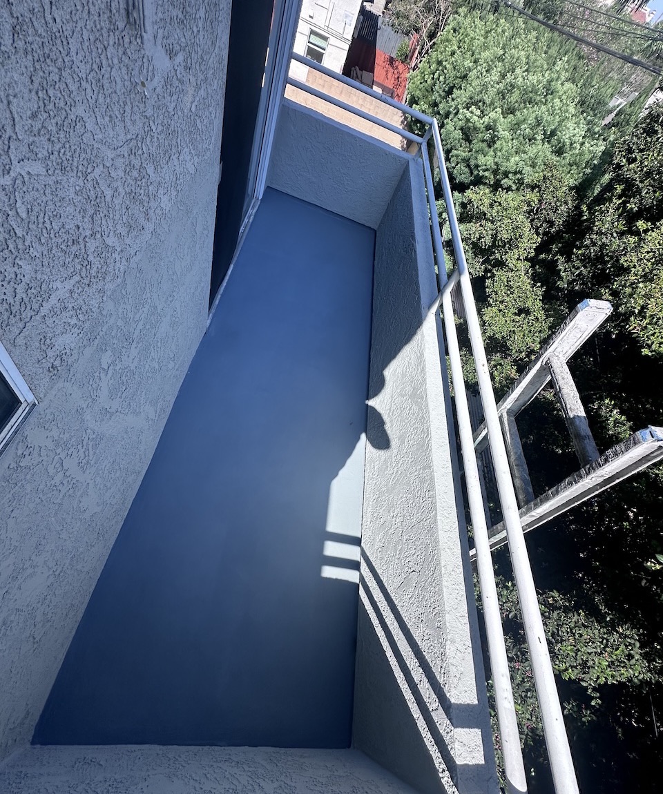 Waterproofed balcony deck, finished coating